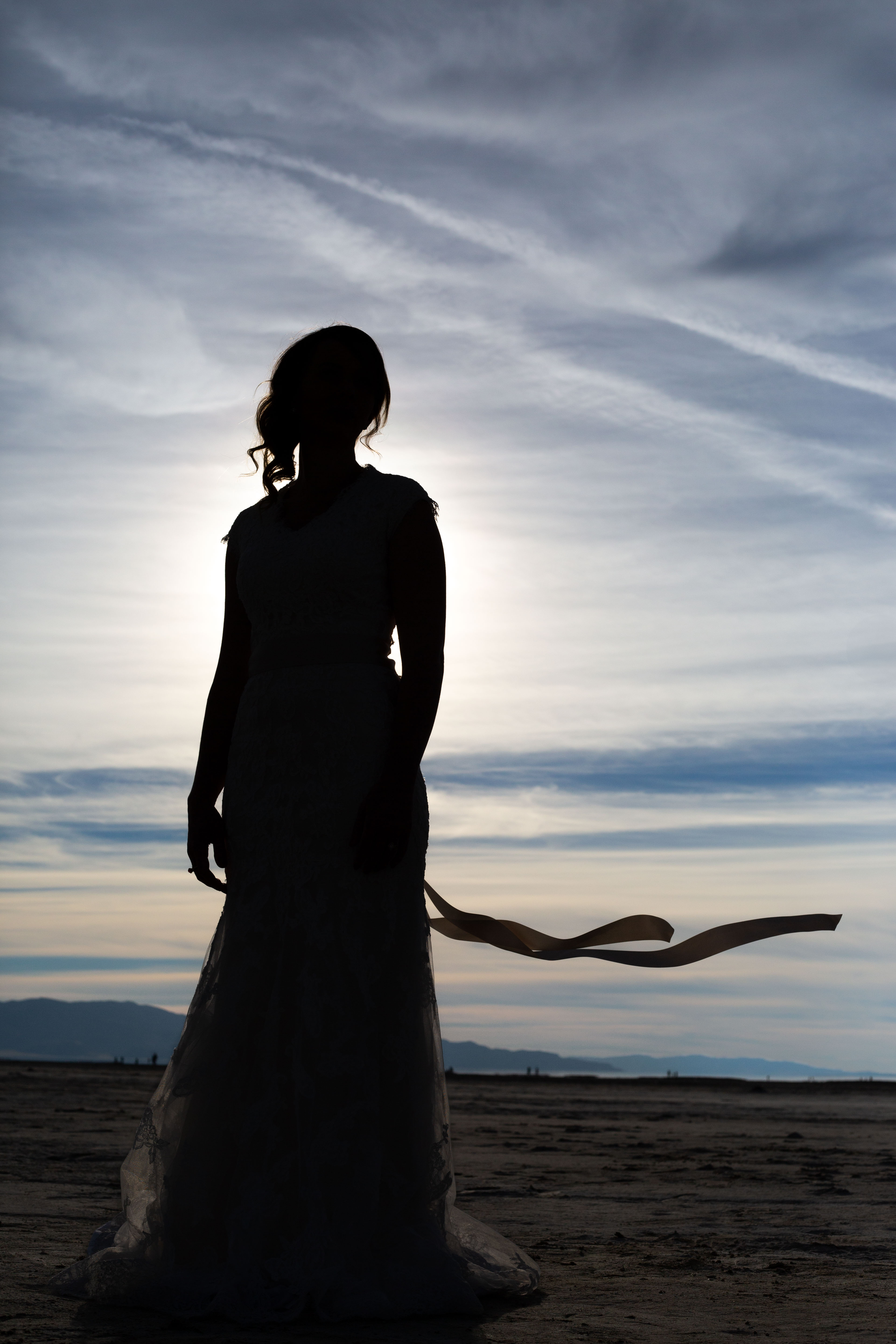 Silhouette of a bride during her bridal photoshoot on the Bonneville Salt Flats.